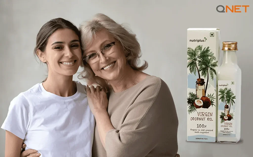 Mother standing with her daughter at home with Nutriplus Virgin Coconut Oil (VCO) by QNET India in the frame