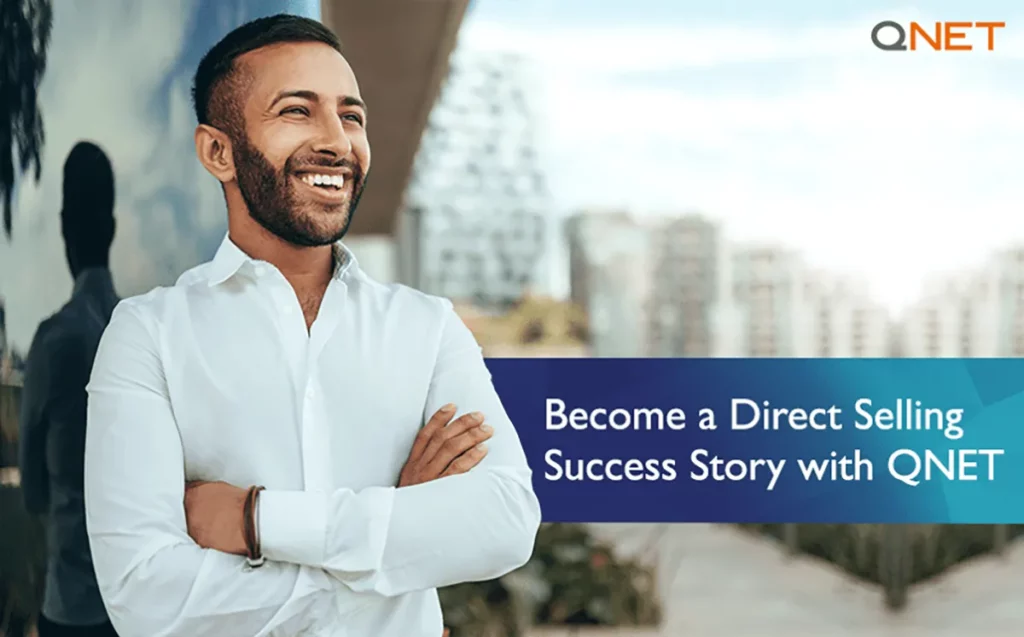 A successful QNET direct seller standing outdoors with his arms folded