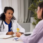 Doctor's Day 2026: Doctor consulting a patient and providing expert medical advice during a routine health check-up